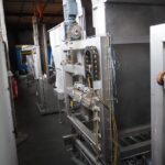 Pallet stacking and de-stacking machine
